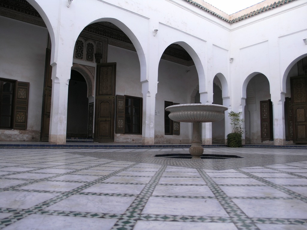 there is a fountain inside of a courtyard