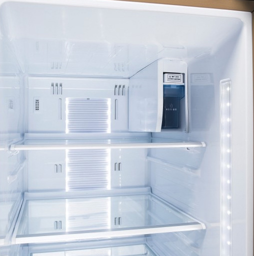 a refrigerator has many doors and drawers to store items