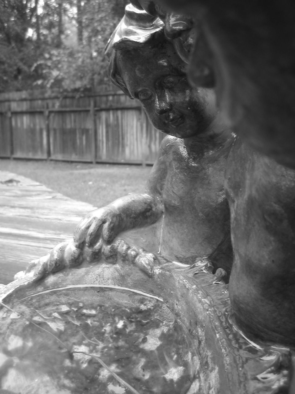 an image of a statue in a city park