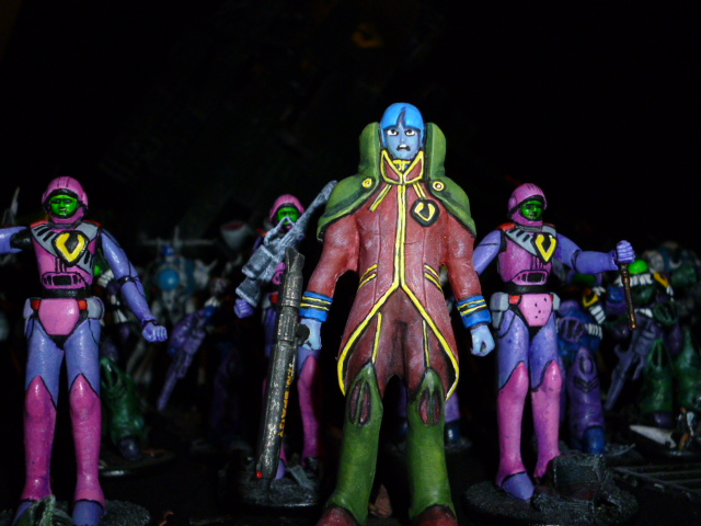 some very weird looking toys of people standing in a group