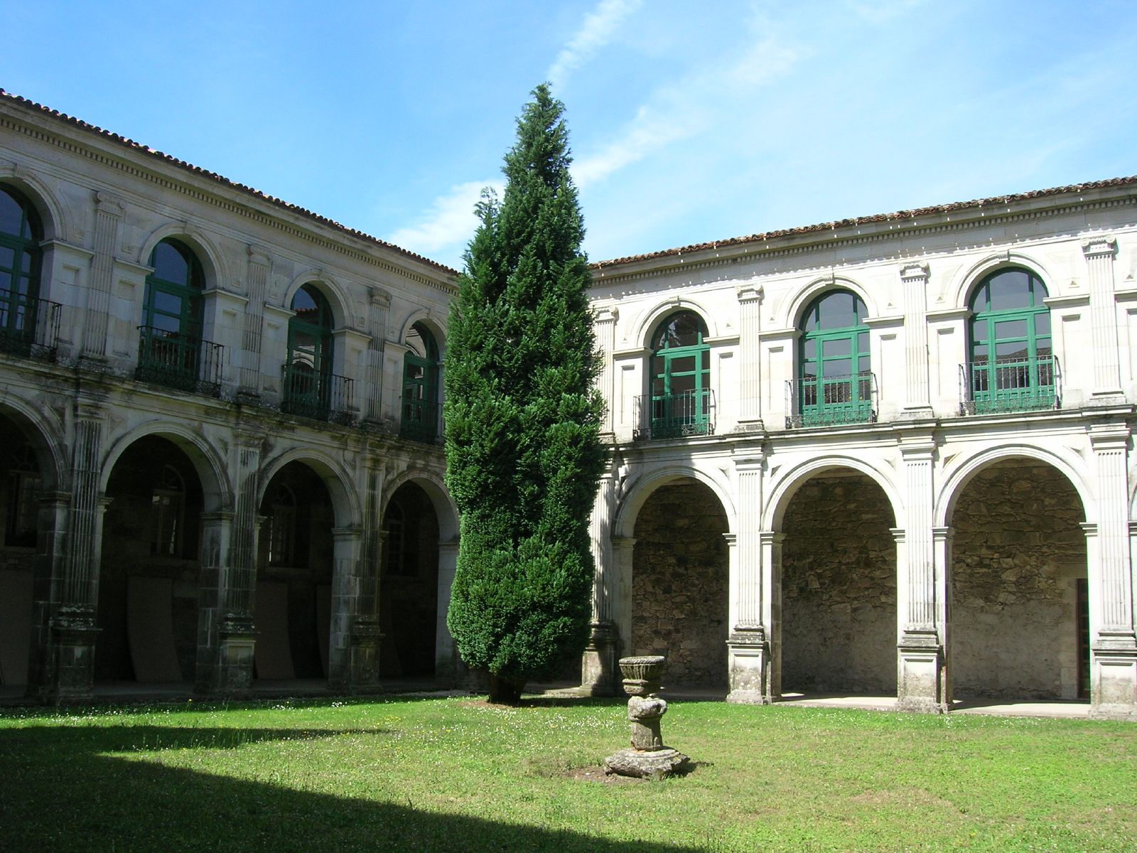 a large courtyard with many arches and pillars