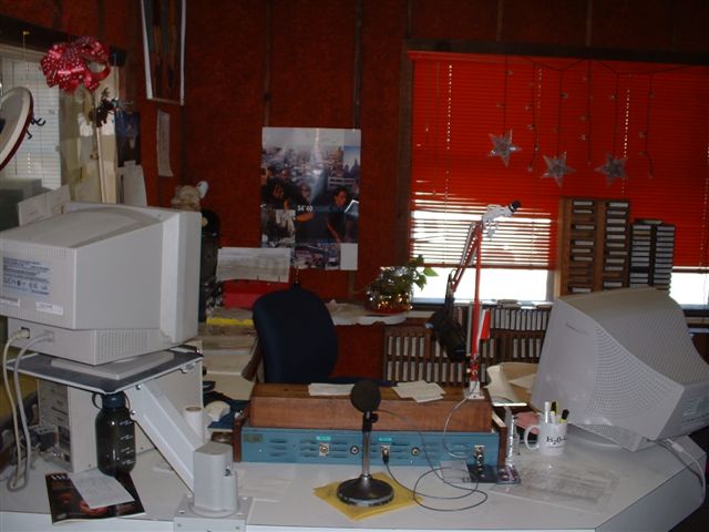 an office with many computer equipment, including a computer, keyboard and mouse