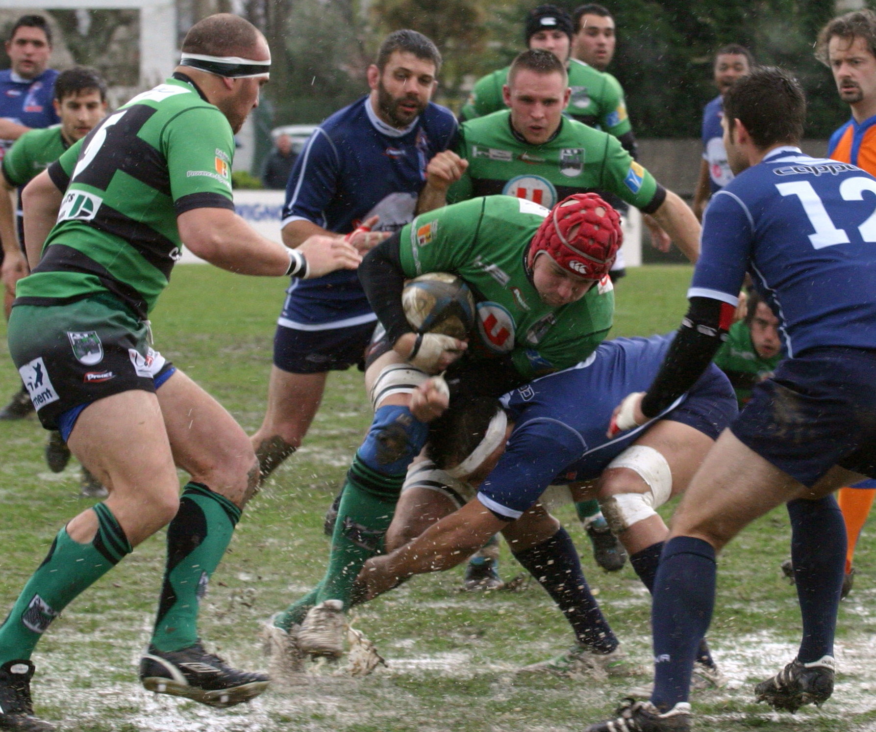 a couple of men playing a game of rugby