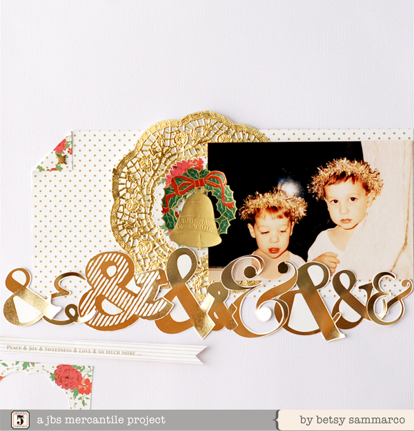 a holiday scrap board with foil accents and a po