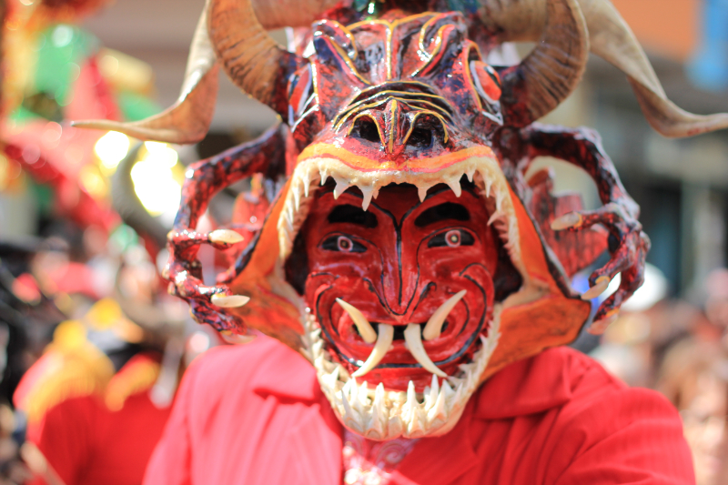 the mask is very elaborate with a demonish grin