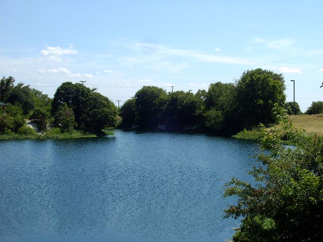 the small lake is a very blue color