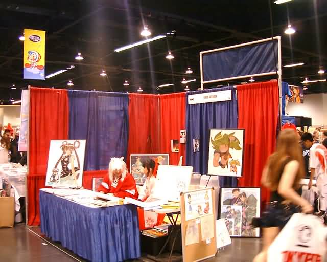 a booth with pictures of athletes at a convention