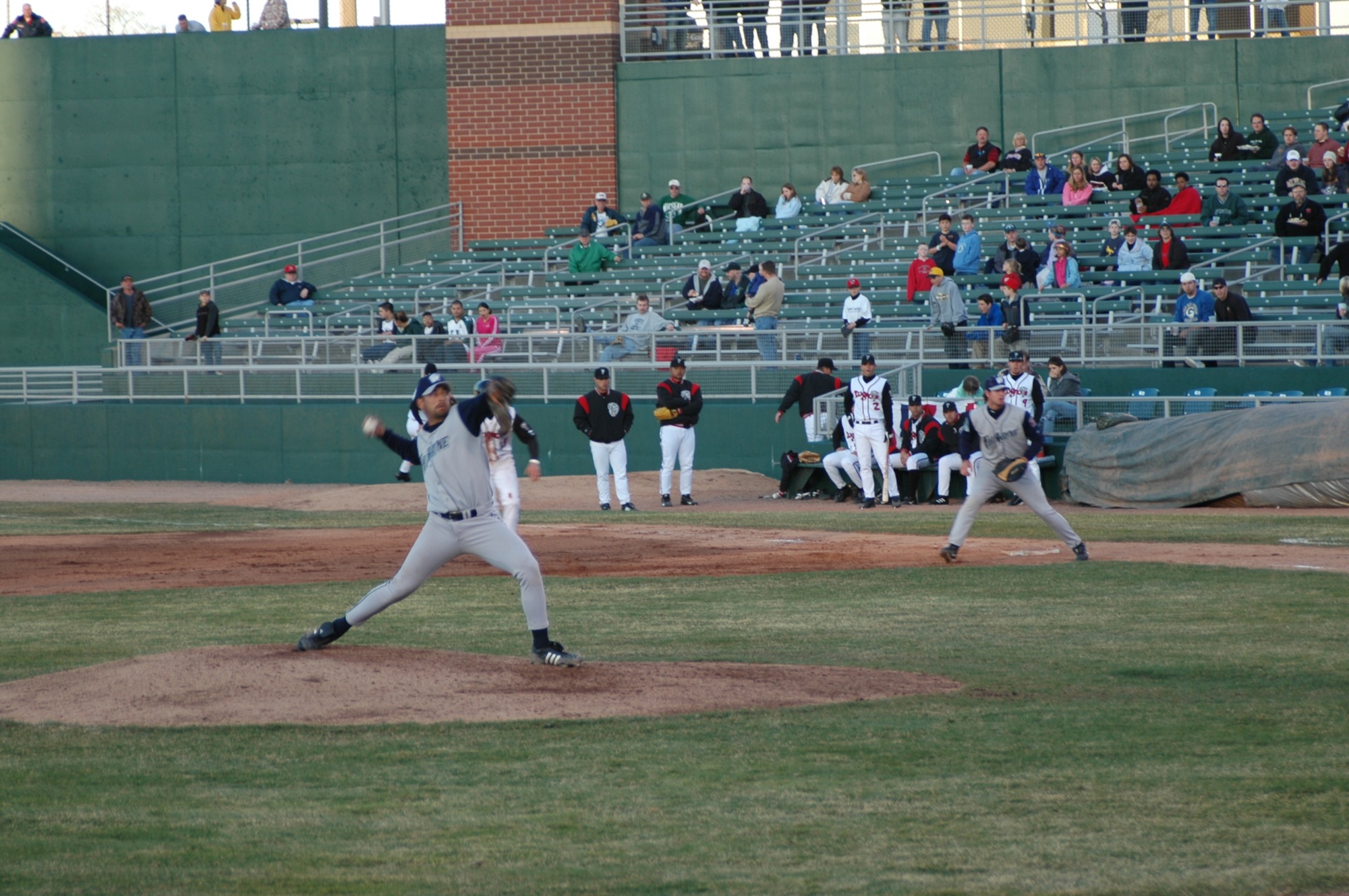 a pitcher throwing a ball to another player during a baseball game