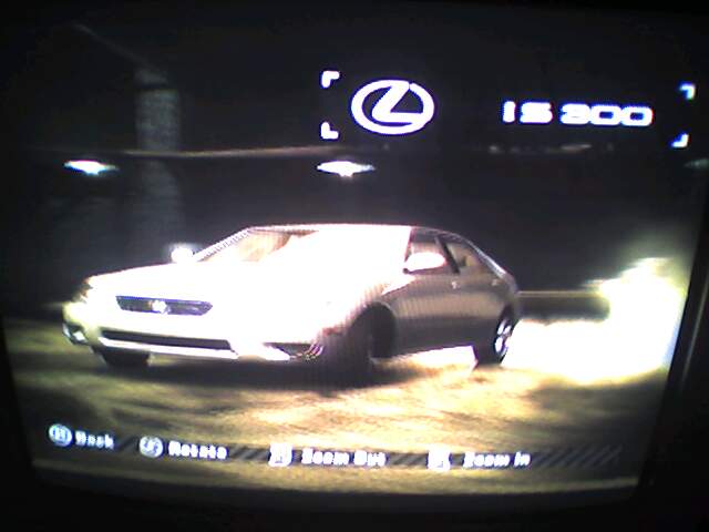 a car is on display in front of the screen