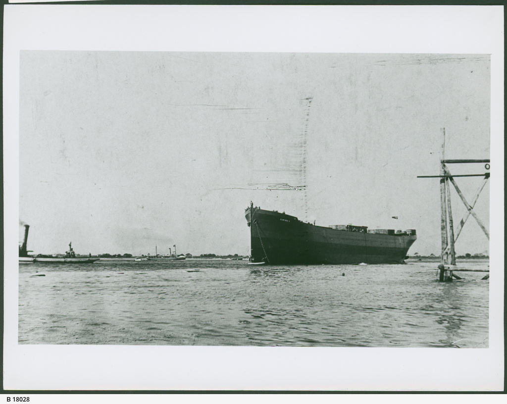 a boat and the large one sitting in the water