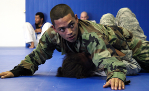two men in uniforms performing a backlock wrestling match