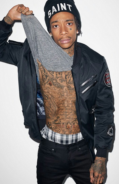 a person with tattoos posing for the camera