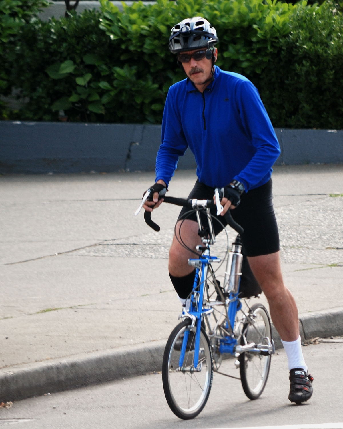 a man rides his bicycle on the street