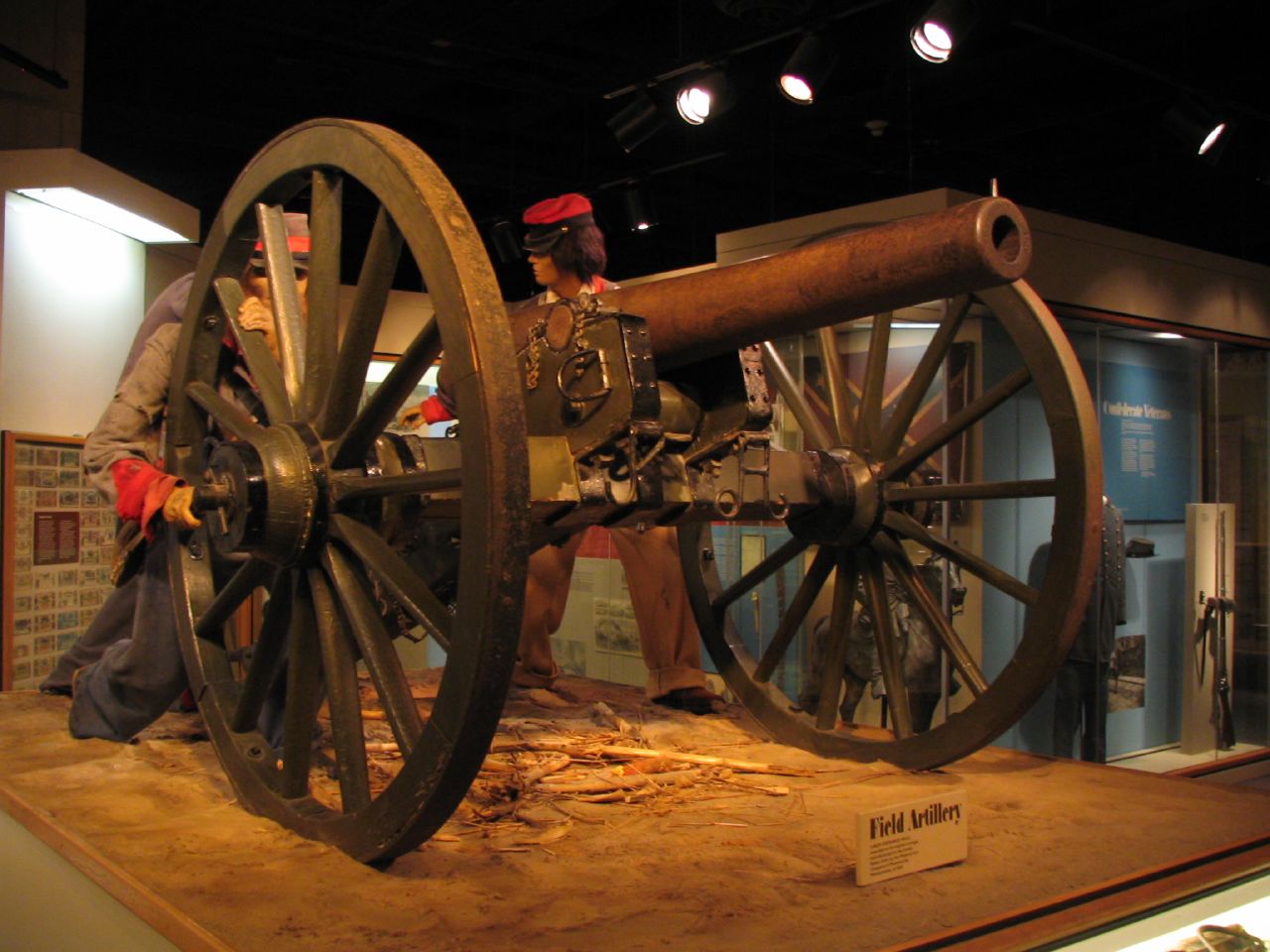 old, gun type device displayed on a pedestal on display