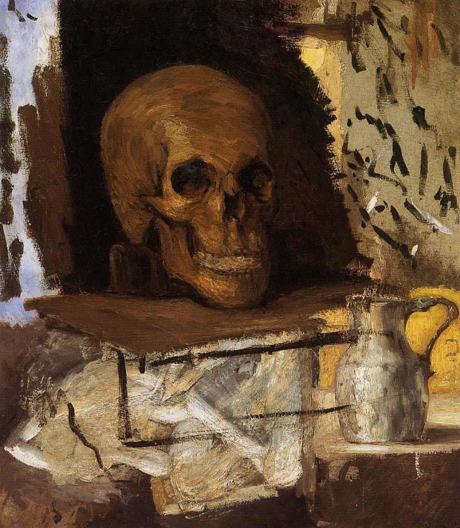 a skull that is in a cave near a cup