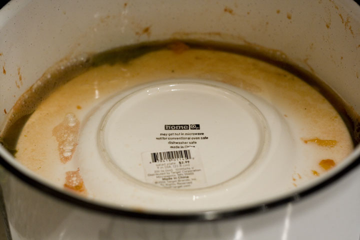 a large pan with soing brown on it