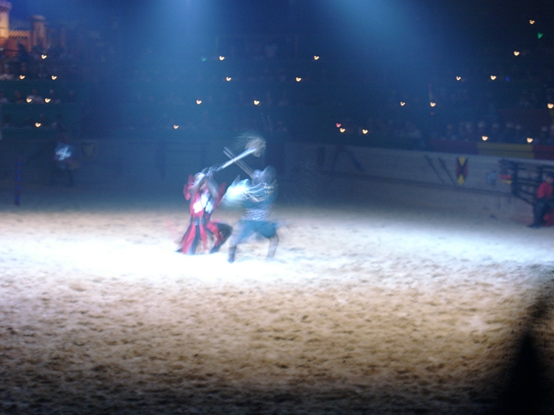 a man is in the arena getting ready to pull a horse while he holds on
