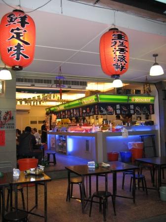 an asian restaurant with asian lanterns on the ceiling