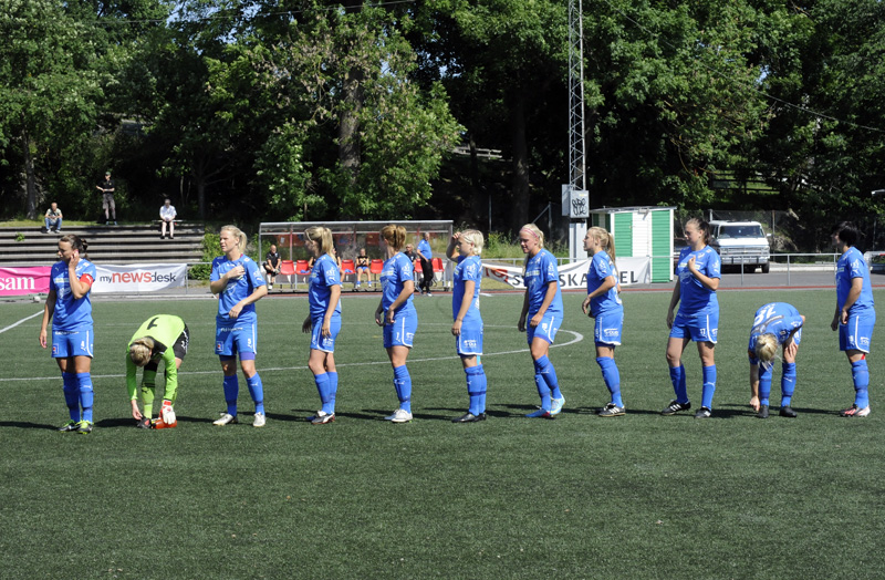 a soccer team standing on the field during a game