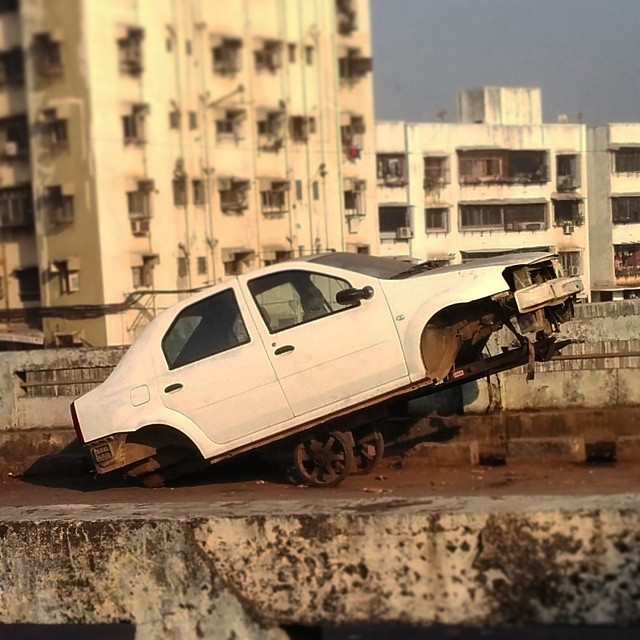 a car that is sitting on top of a wall