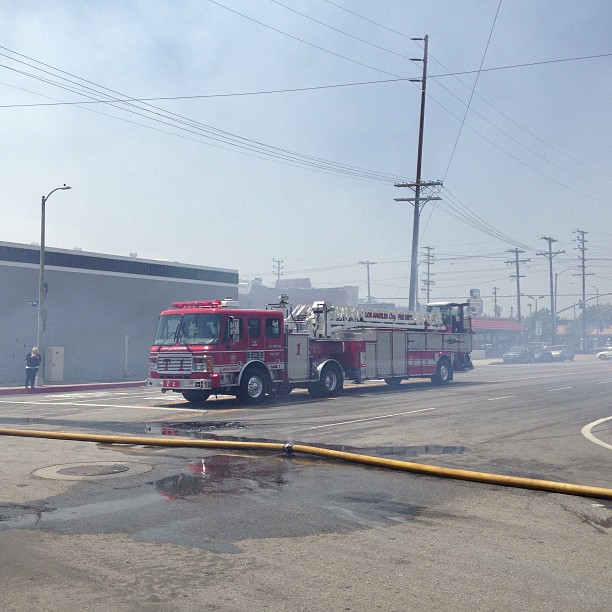 fire trucks parked next to an empty street