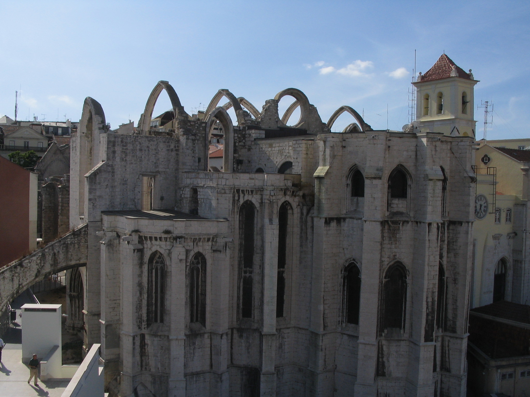 the building is a gothic structure with a clock on top