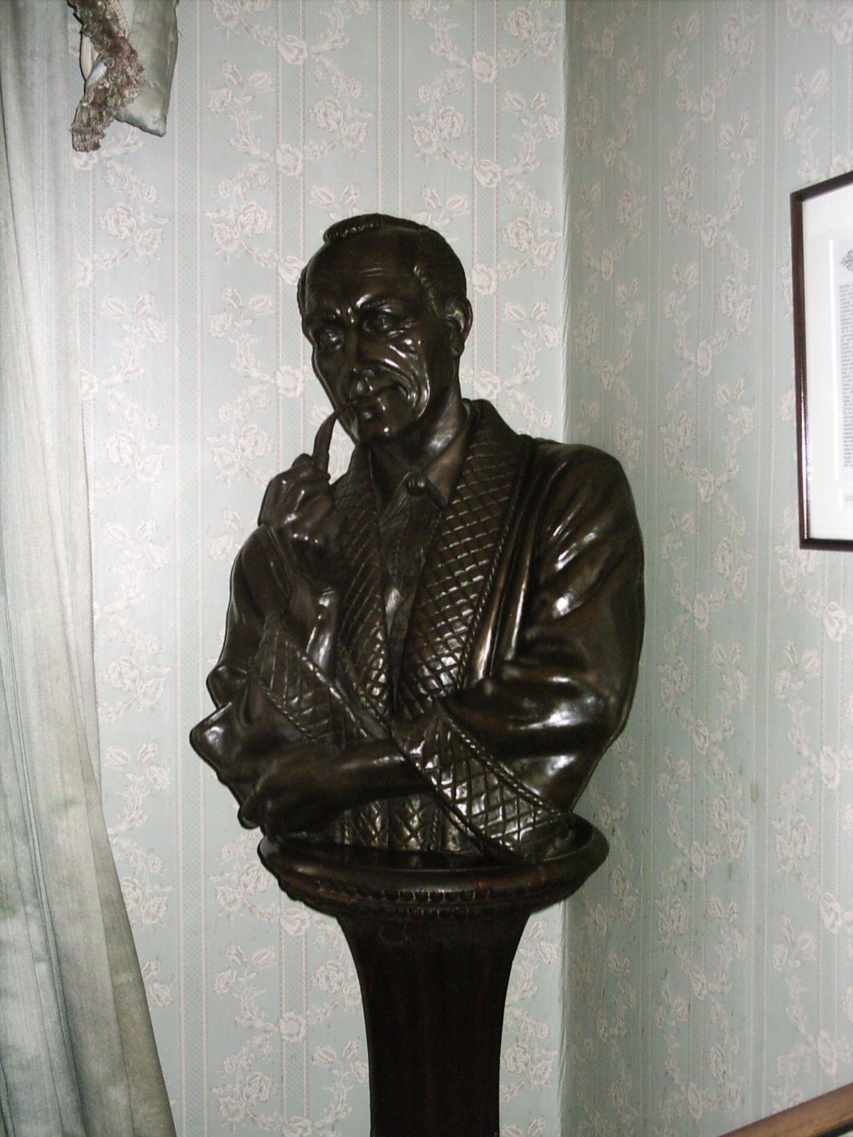 a statue of a man in a coat