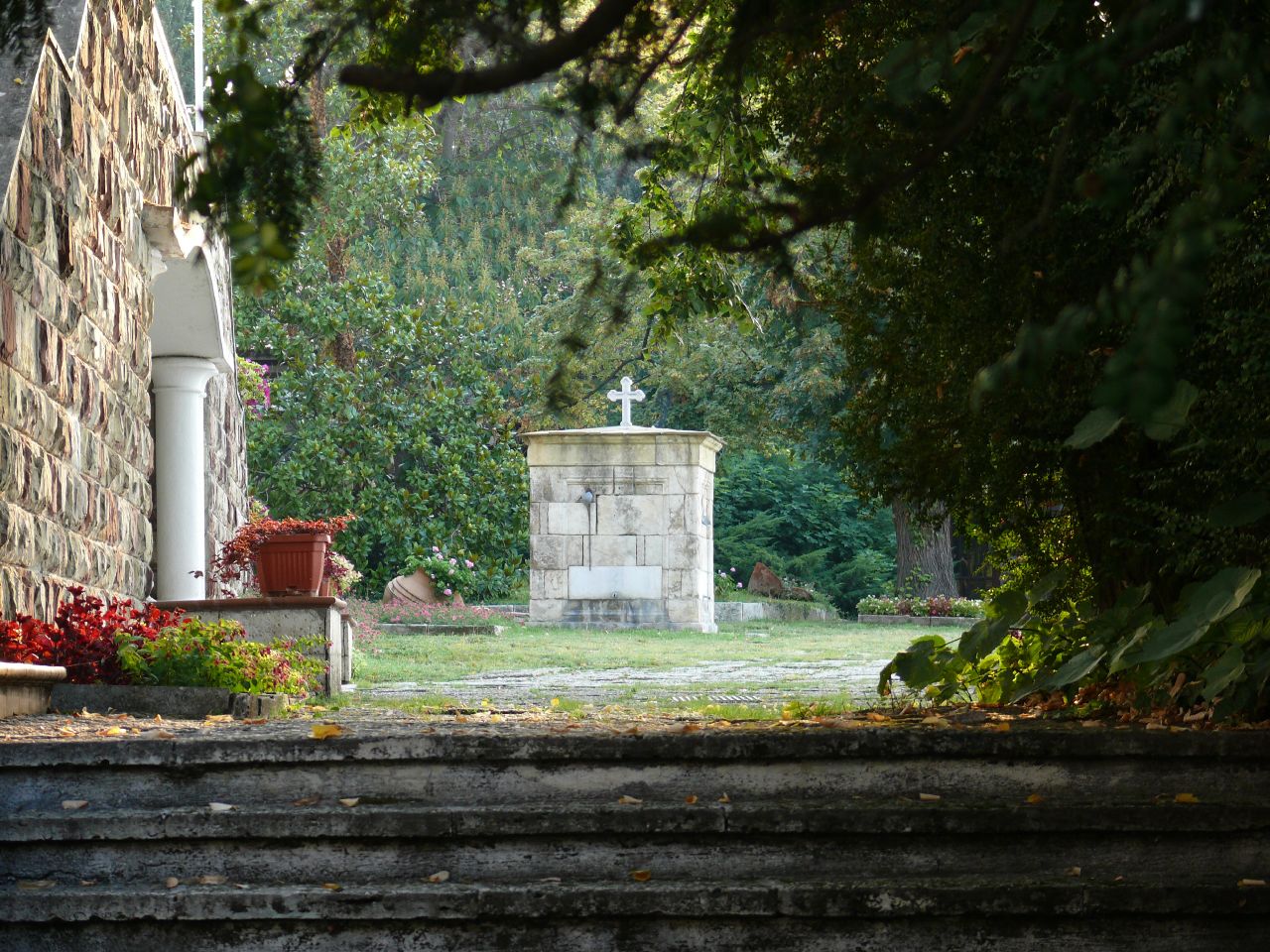 the outside of an old brick church in the background