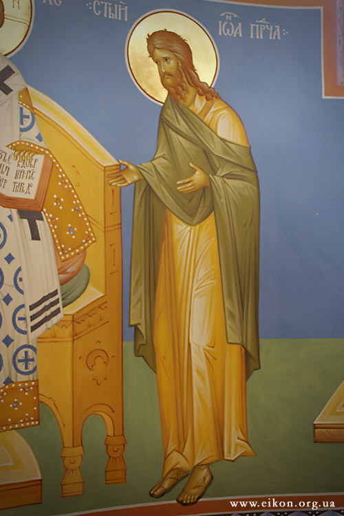the painting on the wall depicts jesus with other saints