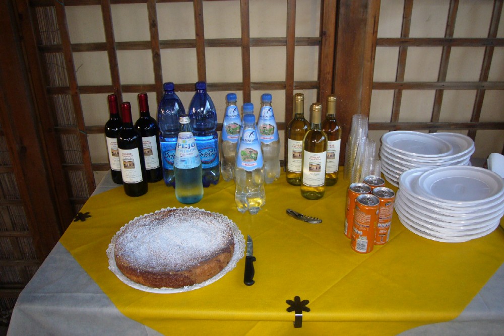 the table is covered with dishes and bottles