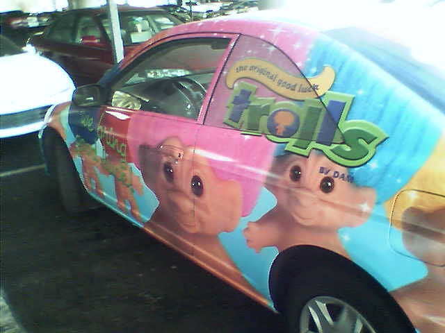 a colorful car is painted with ice cream