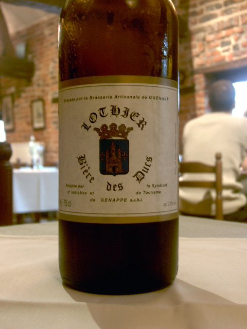 a bottle of beer sitting on top of a table