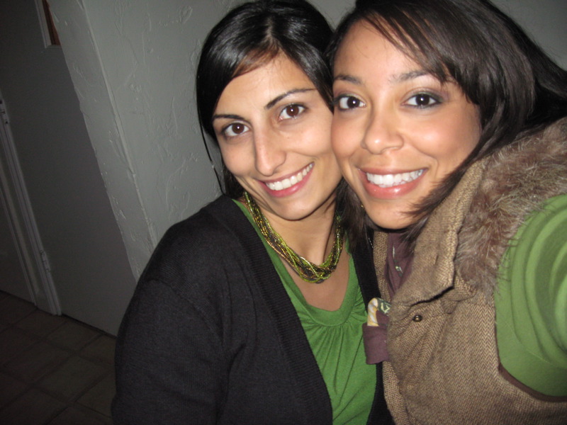 two beautiful young women smiling and hugging each other