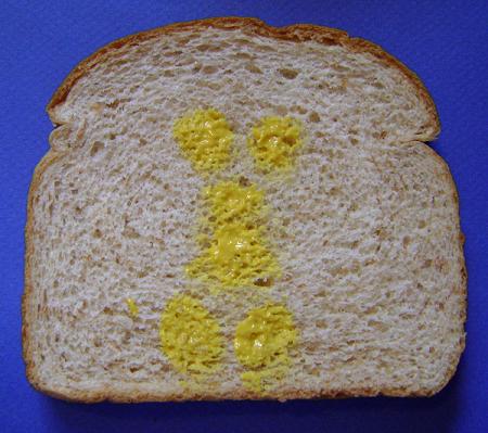 a piece of bread with yellow flowers on it