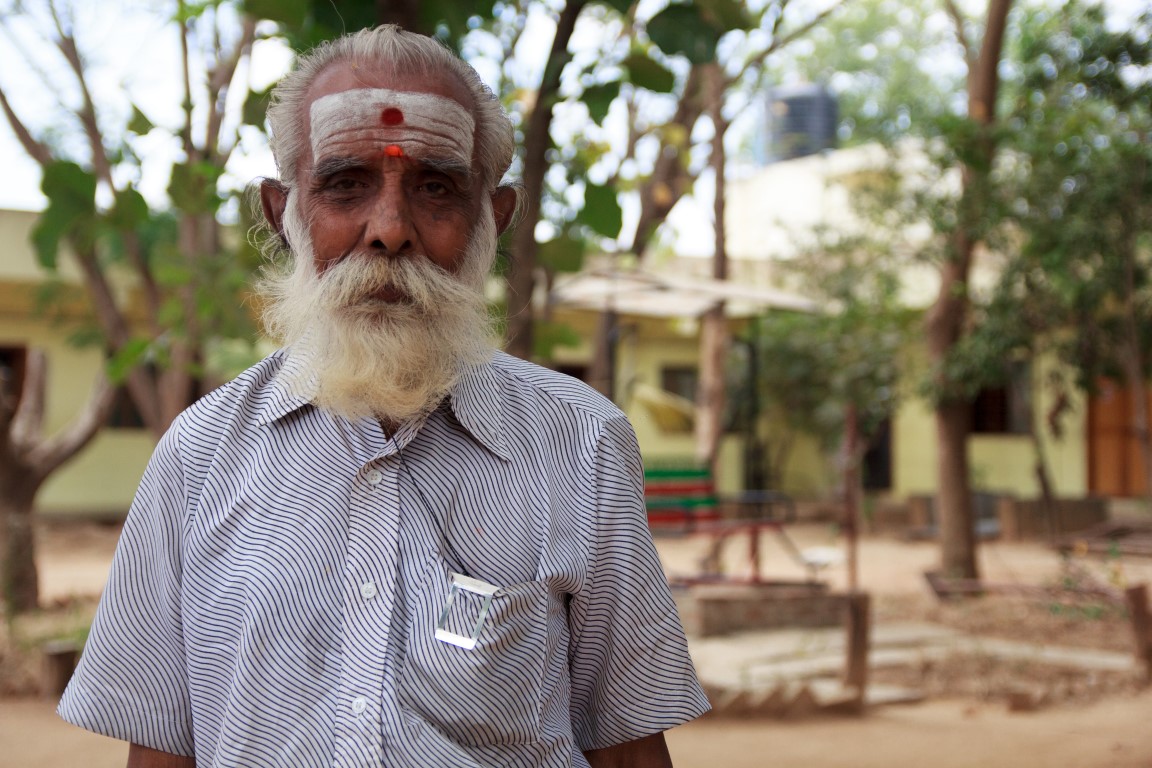 a man with a white beard and a grey mustache