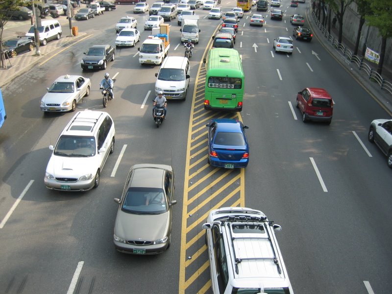 a long freeway filled with lots of vehicles