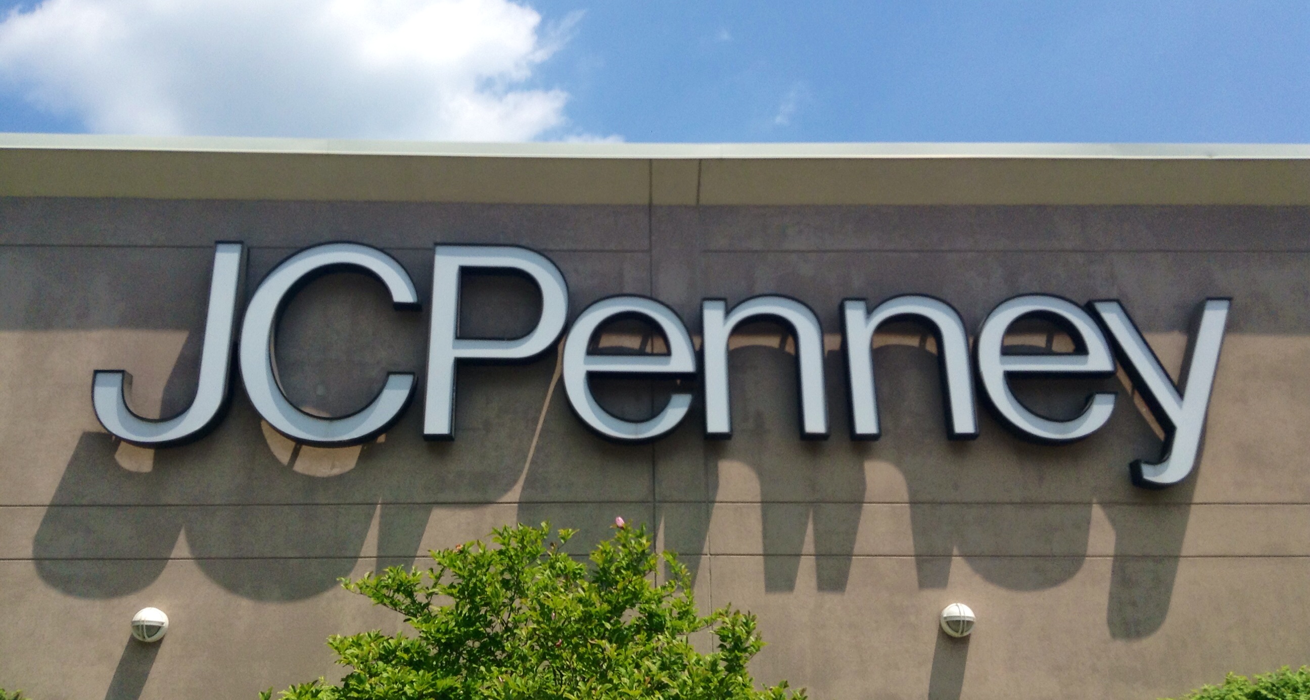 the jcpenney sign on top of a store