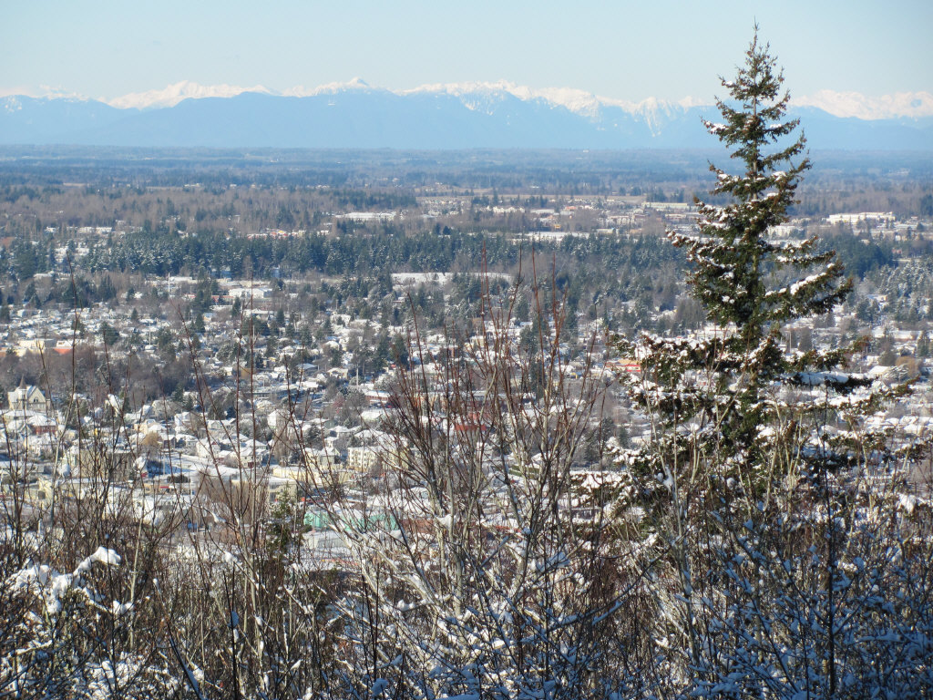 a picture taken from the top of a mountain looking out at a town