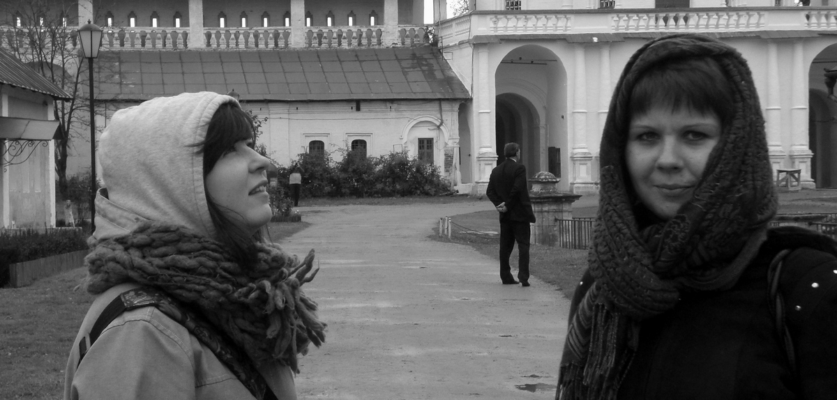 a couple of women in winter clothes standing next to each other