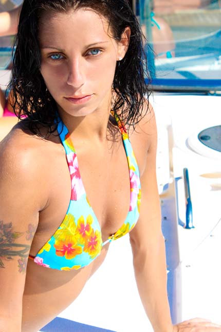 a beautiful young lady in a blue and floral bikini