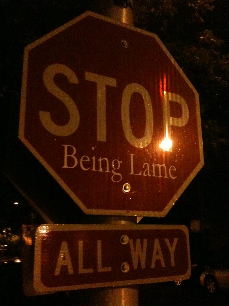 a close up of a stop sign with a street name underneath it