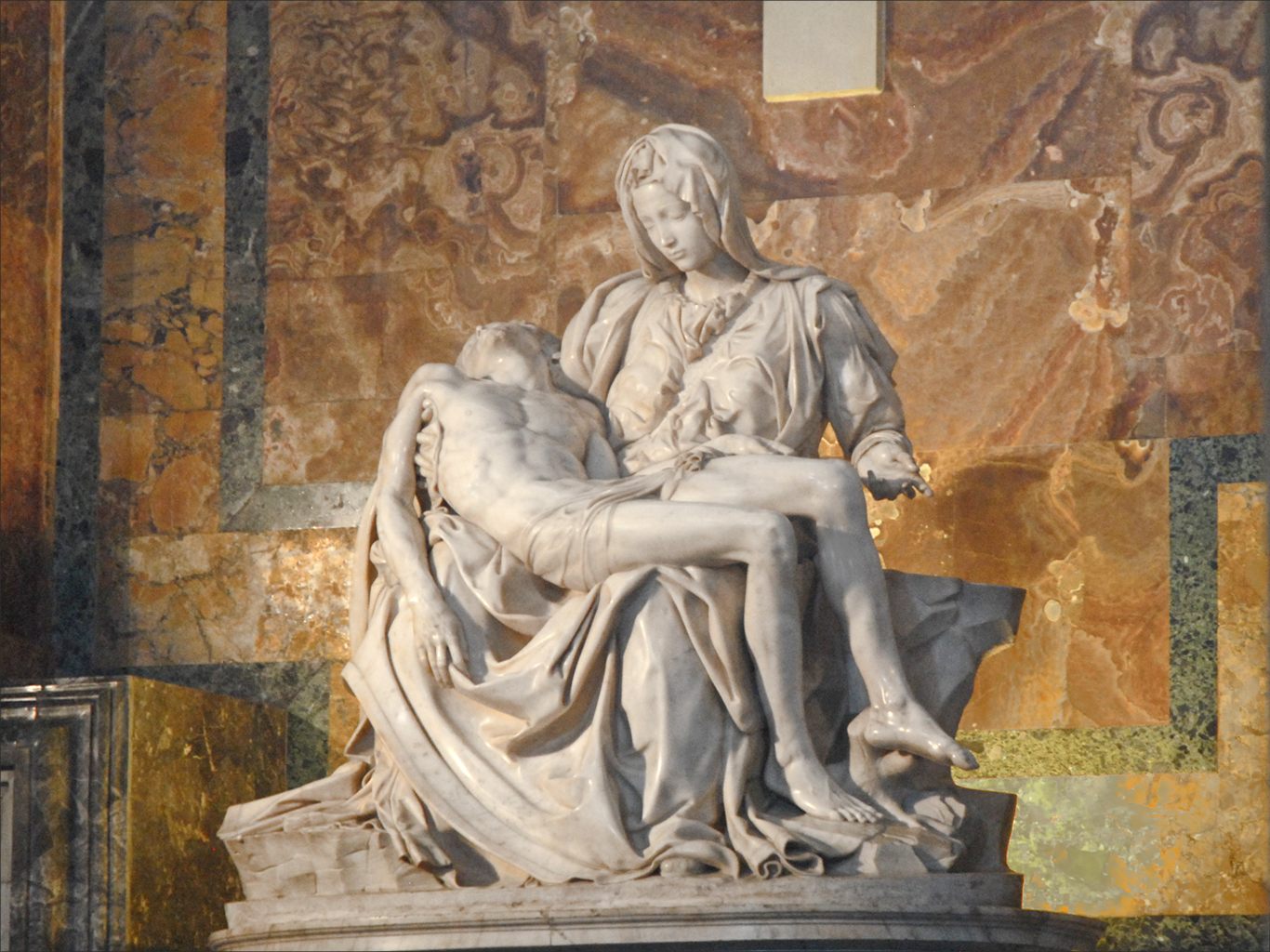 a large marble sculpture of a woman next to a man