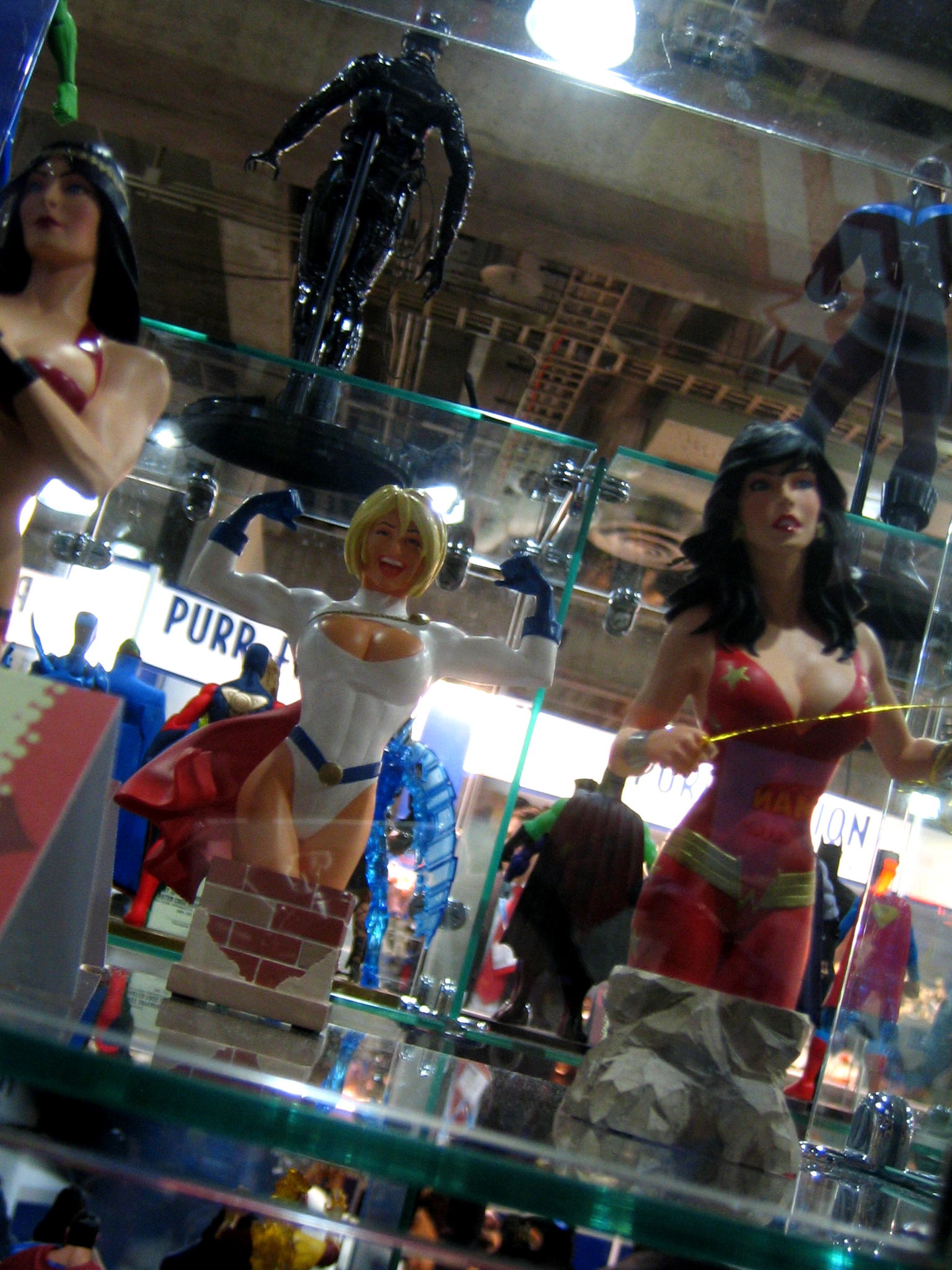 two toy figurines and one figurine are on display