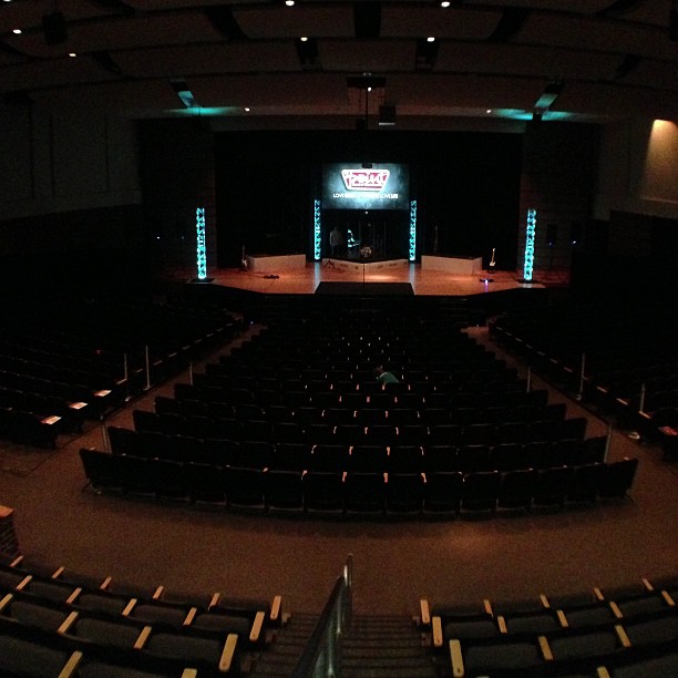 the auditorium stage is empty and there are no people