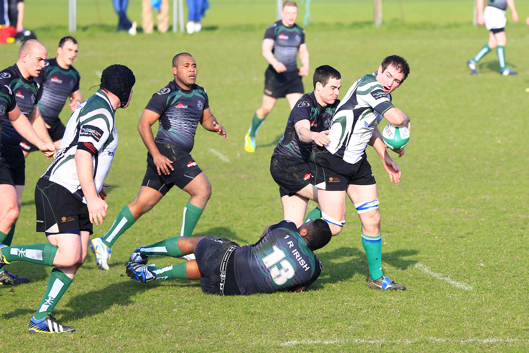 a rugby team running after a ball on the field