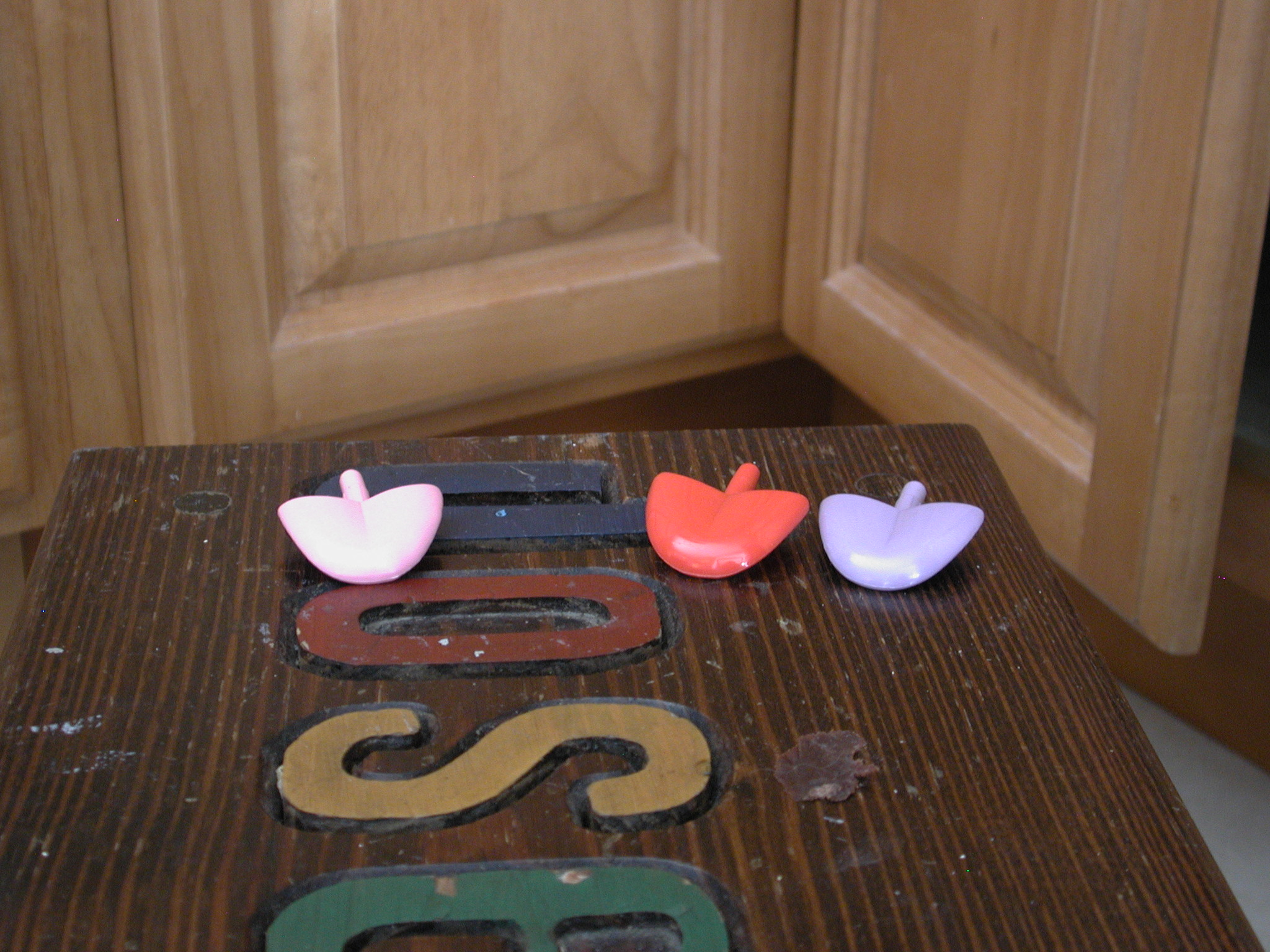 three plastic items on top of a table