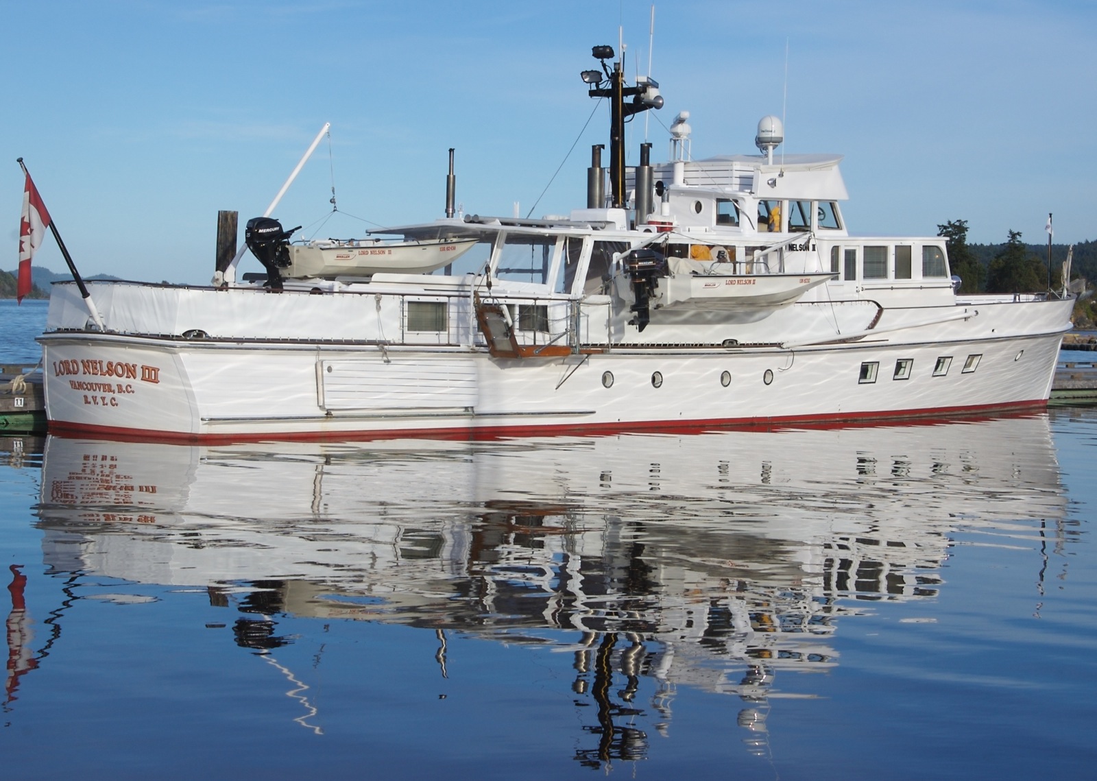 a large white boat in the water at dock