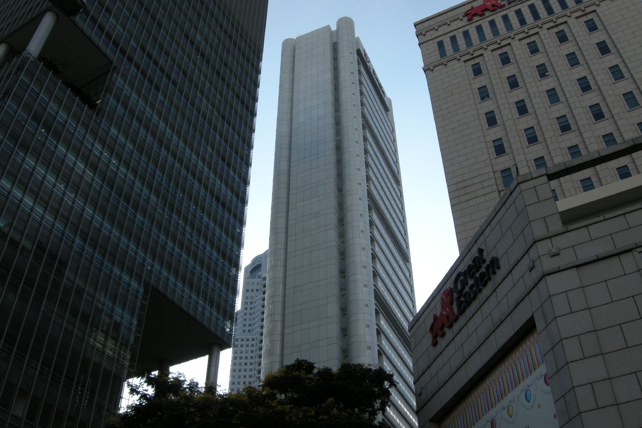 looking up at some buildings from the ground