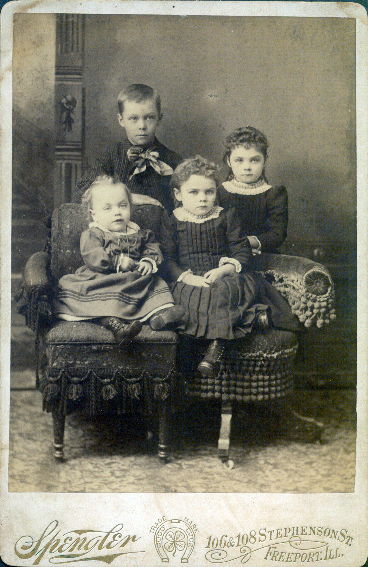 a black and white po shows five children