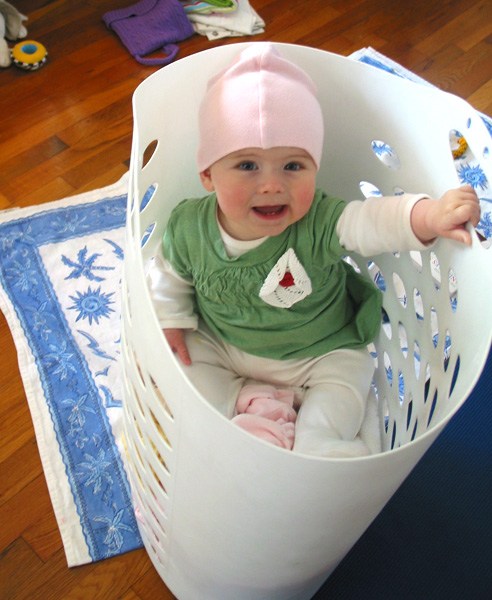 there is a baby in a white basket